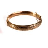 An interesting silver gilt Elizabeth II hinged bangle, with engraved top section, marked Chester