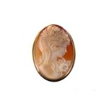 A 9ct gold shell cameo brooch/pendant, depicting profile of a young girl