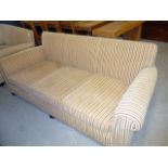 A three seat roll arm sofa, upholstered in striped fabric