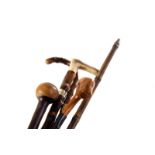 Four vintage walking sticks, including an antler handled example, plus a knop Kerri (5)