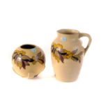 A Whieldon pottery vase and matching jug, c1930, both with autumnal coloured floral decoration (2)