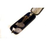 A gentleman's lot: A pair of silver cufflinks with engraved swag design, marked Birmingham, together