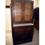 A vintage stained pine kitchen cabinet, having lead glazed design to top, with lower pull-out