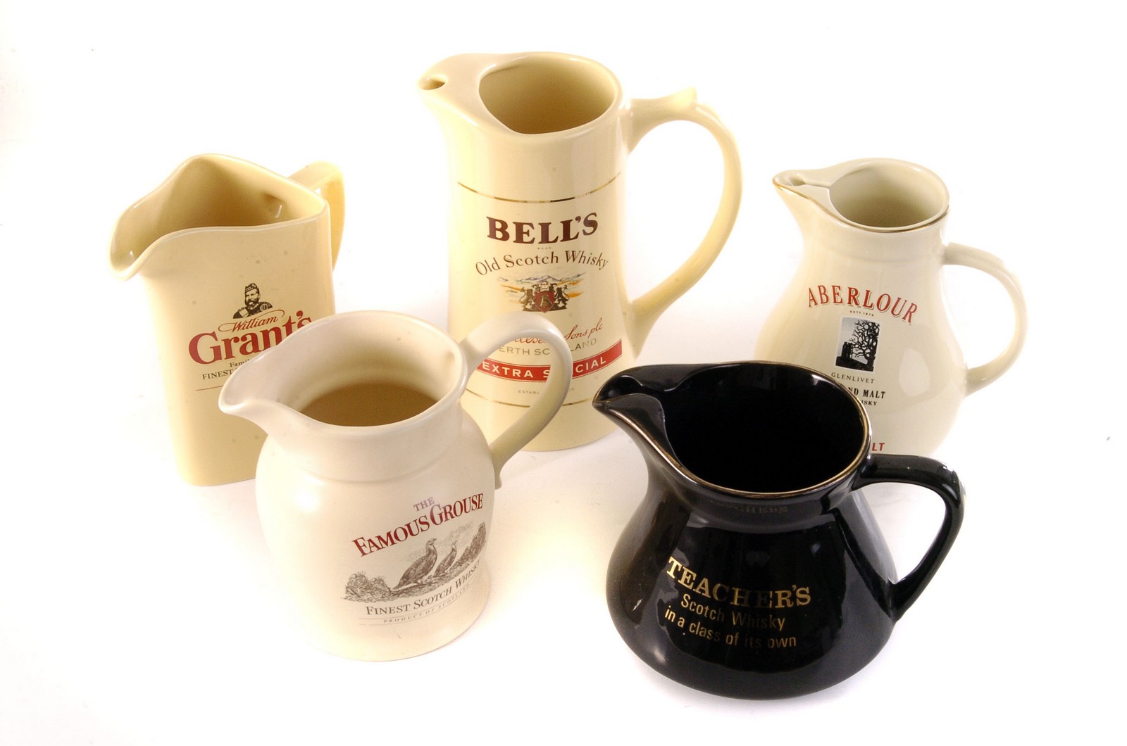 A selection of whisky branded water jugs, comprising Bells, Famous Grouse, Grants and others,