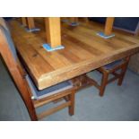 A large reclaimed pine eight seat refectory dining table, approx 244cm L