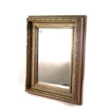 A rectangular gilt painted bevelled glass wall mirror, approx 54cm by 44cm