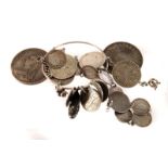 A collection of British and American coins, some mounted in jewellery, comprising a Charles II and