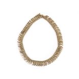 A 14ct gold choker necklace, made up of chevron design links with textured and smooth uppers, marked