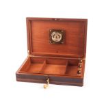 A Dunhill Macassar ebony humidor, with brass edging, and line inlay, opening to reveal moisture