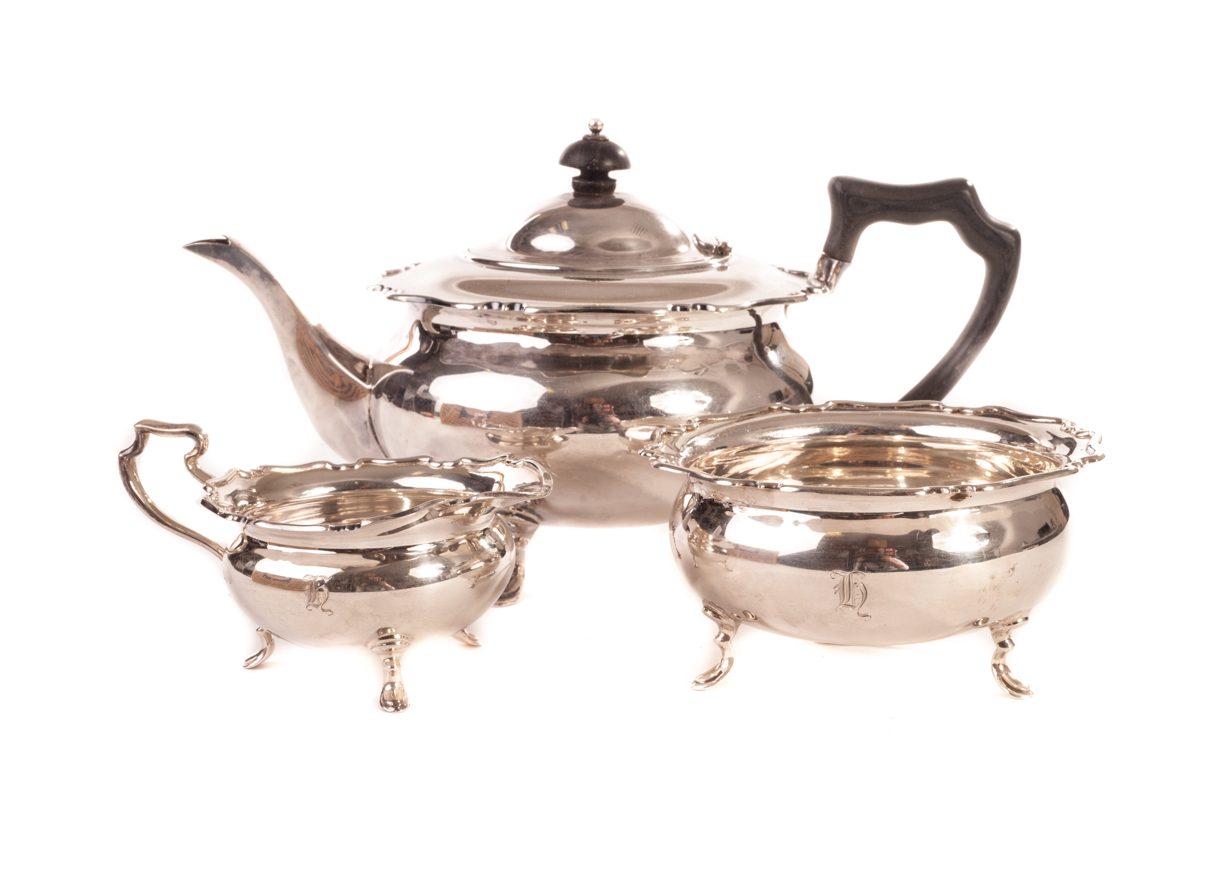 A George V three piece silver tea set, by Wilson & Sharp, London 1910 27ozt Impact damage to one leg