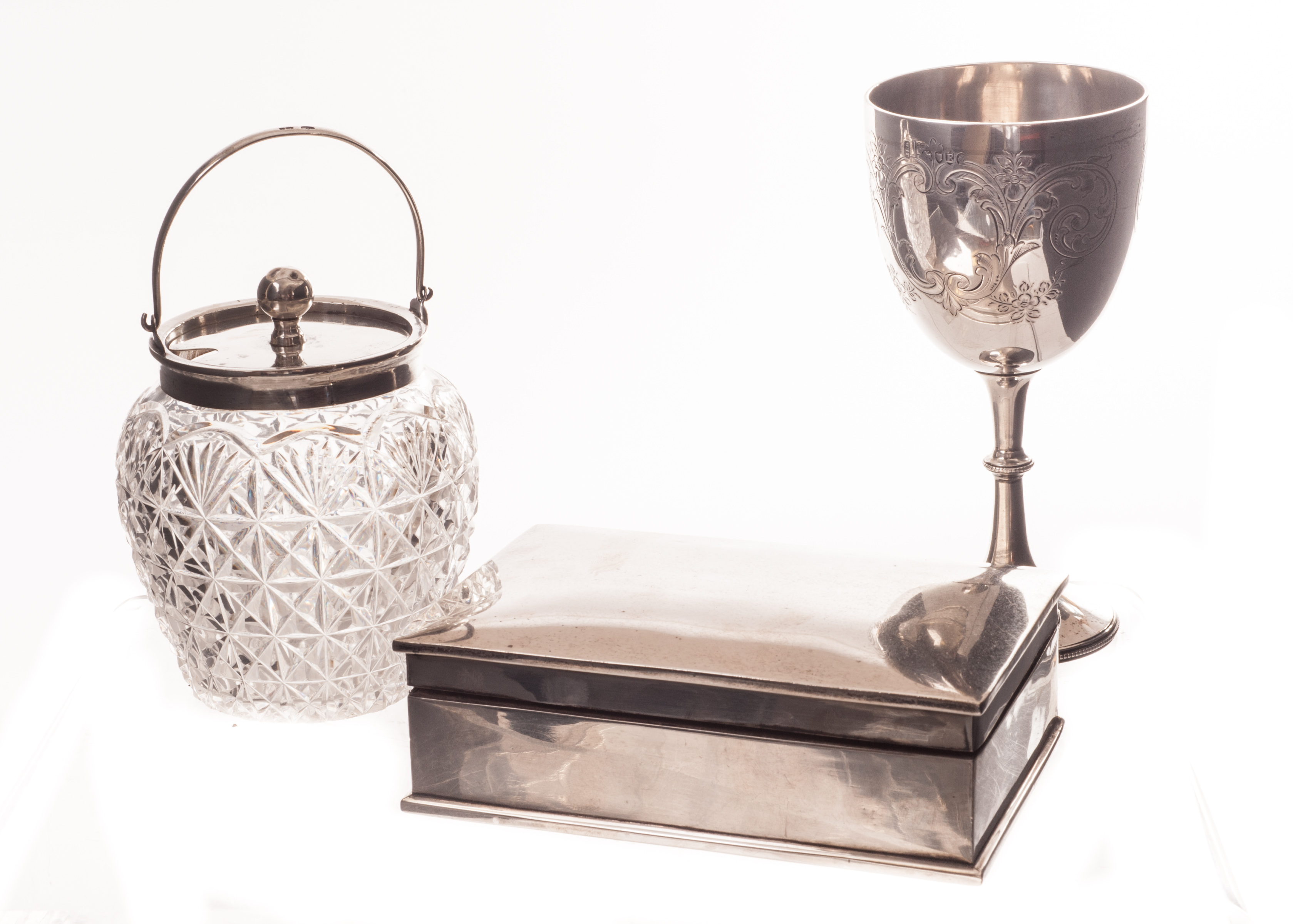 A Victorian silver goblet, together with an Art Deco silver cigarette box, and an Edwardian cut