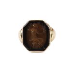 An antique gold and hardstone signet ring, the octagonal panel with intaglio of seated figure with