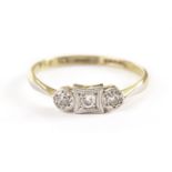 An Art Deco three stone diamond ring, the old cuts in platinum illusion set tablet on an 18ct gold