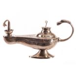 A Middle Eastern white metal oil lamp table lighter, having engraved script to upper with a stylised