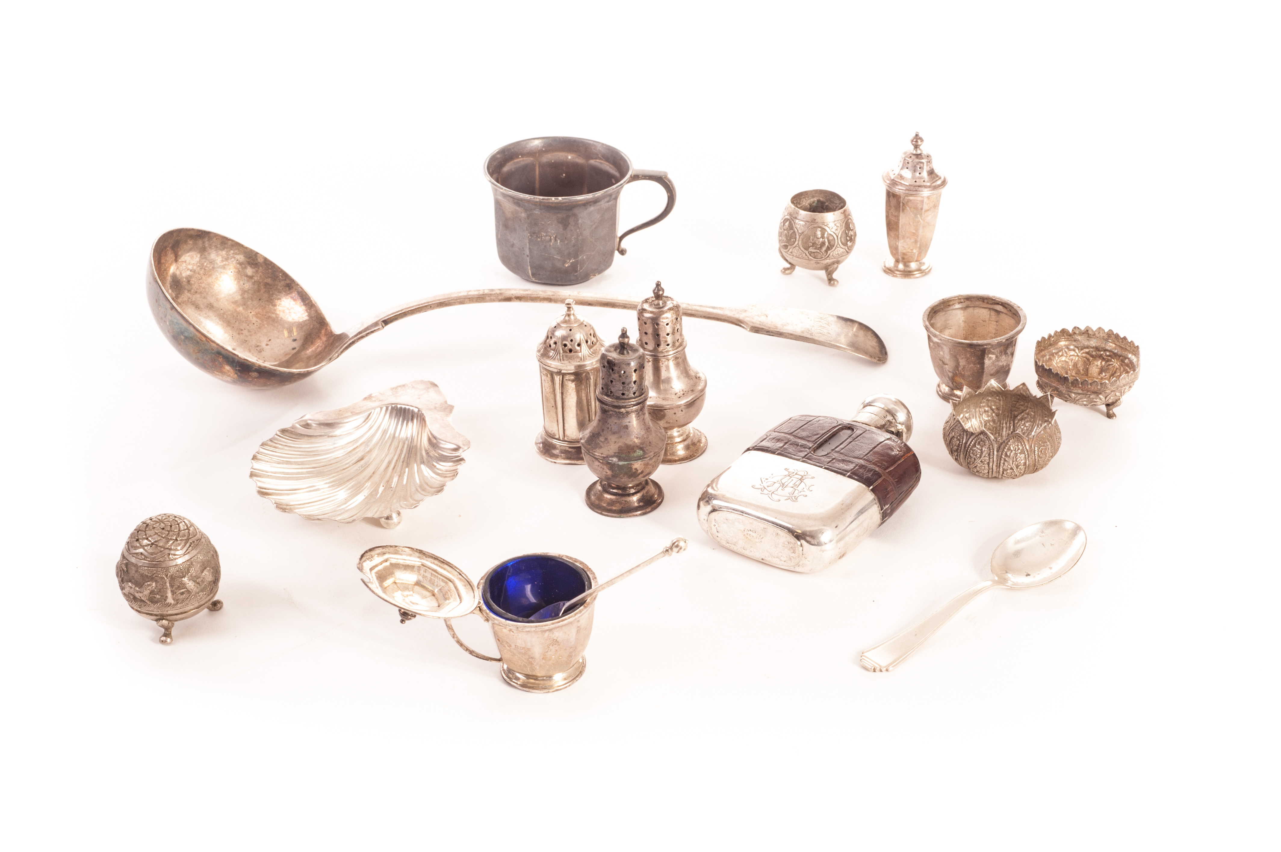 A collection of silver and silver plated items, including a silver shell butter dish, a pair of