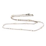 A pretty white metal and seed pearl chocker necklace, the oval seed pearls, alternately set with