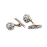 A rare pair of Art Nouveau silver and enamel cufflinks from Liberty & Co, having a circular button