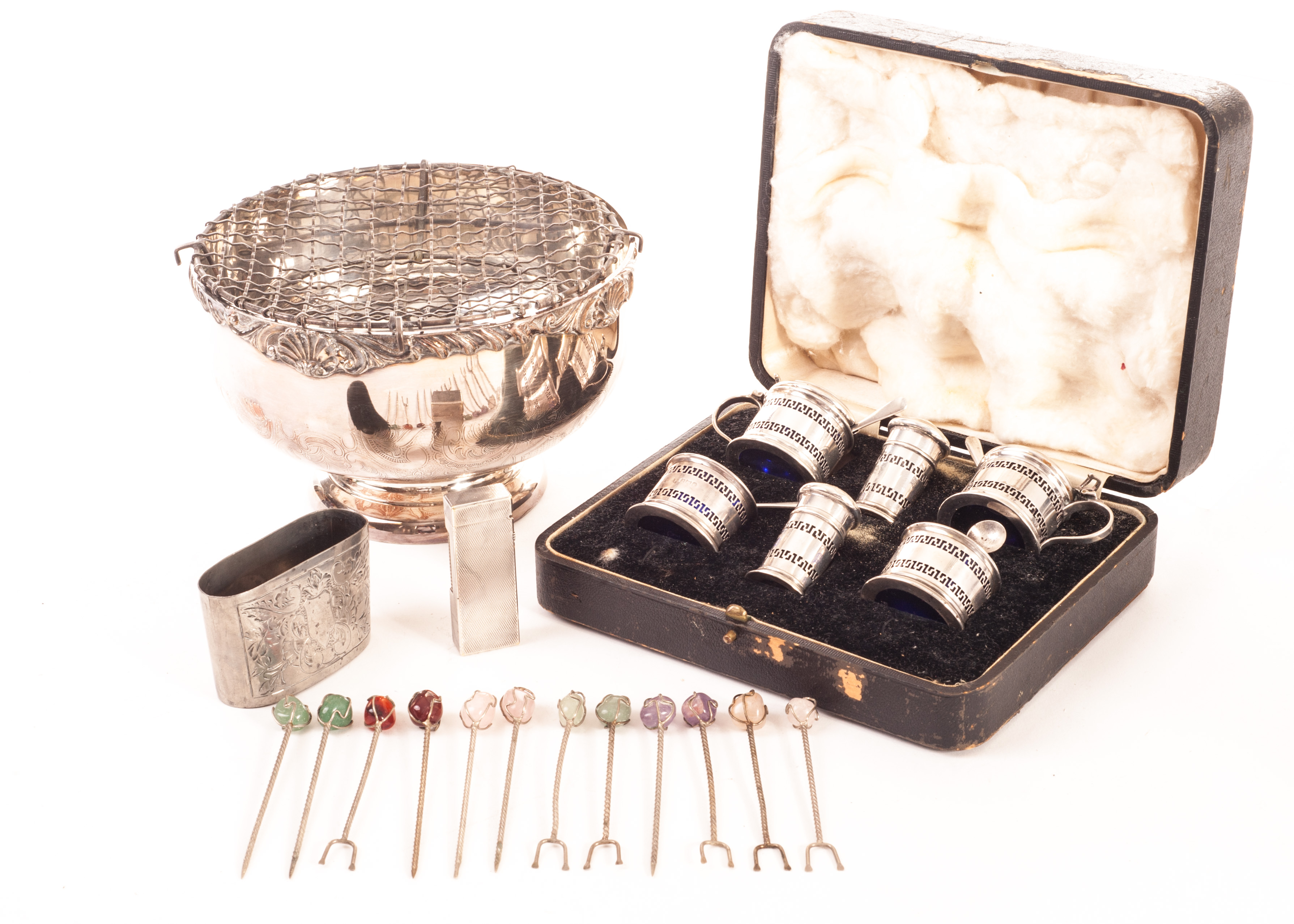 A George V silver cased set of cruets, including a pair of peppers, mustards and salts with glass