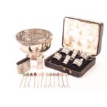 A George V silver cased set of cruets, including a pair of peppers, mustards and salts with glass