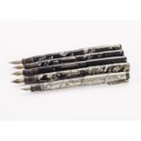 A group of five vintage Swan fountain pens, including one black self filler, two marbled and one