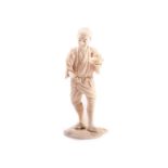 A Meiji period Tokyo school ivory Okimono, of a young man in traditional dress carrying a bowl,