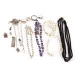 A collection of silver and other costume jewellery, including a silver ingot pendant, a flattened