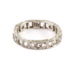 A 9ct white gold eternity ring, with round and baguette cut white stones, size P