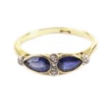 A pretty Edwardian period sapphire and diamond dress ring, having a pair of teardrop shaped good