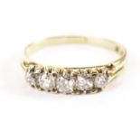 A vintage five stone diamond ring, set with graduating old cushion cut stones in claw mounts,