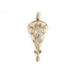 An Edwardian 15ct gold pendant, set with seed pearls and centred with a blue cut stone, one pearl