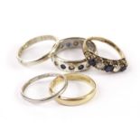 A group of five wedding bands and rings, including a platinum band, approx 2g, an 18ct white gold