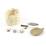 Three 9ct gold and gem set rings, AF, together with a 15ct and gem set stick pin, a carved bone