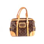 A Louis Vuitton Monogram style lady’s handbag, with chocolate leather body, and tan buckled straps