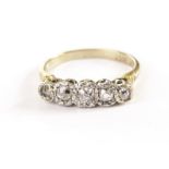 An Art Deco period five stone diamond engagement ring, having old cut stones in platinum illusion