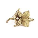 An 18ct gold flower brooch, naturalistically modelled as an iris of orchid having a blister pearl to