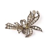 An Edwardian period diamond set floral spray brooch, the tied bouquet of flowers gold and silver