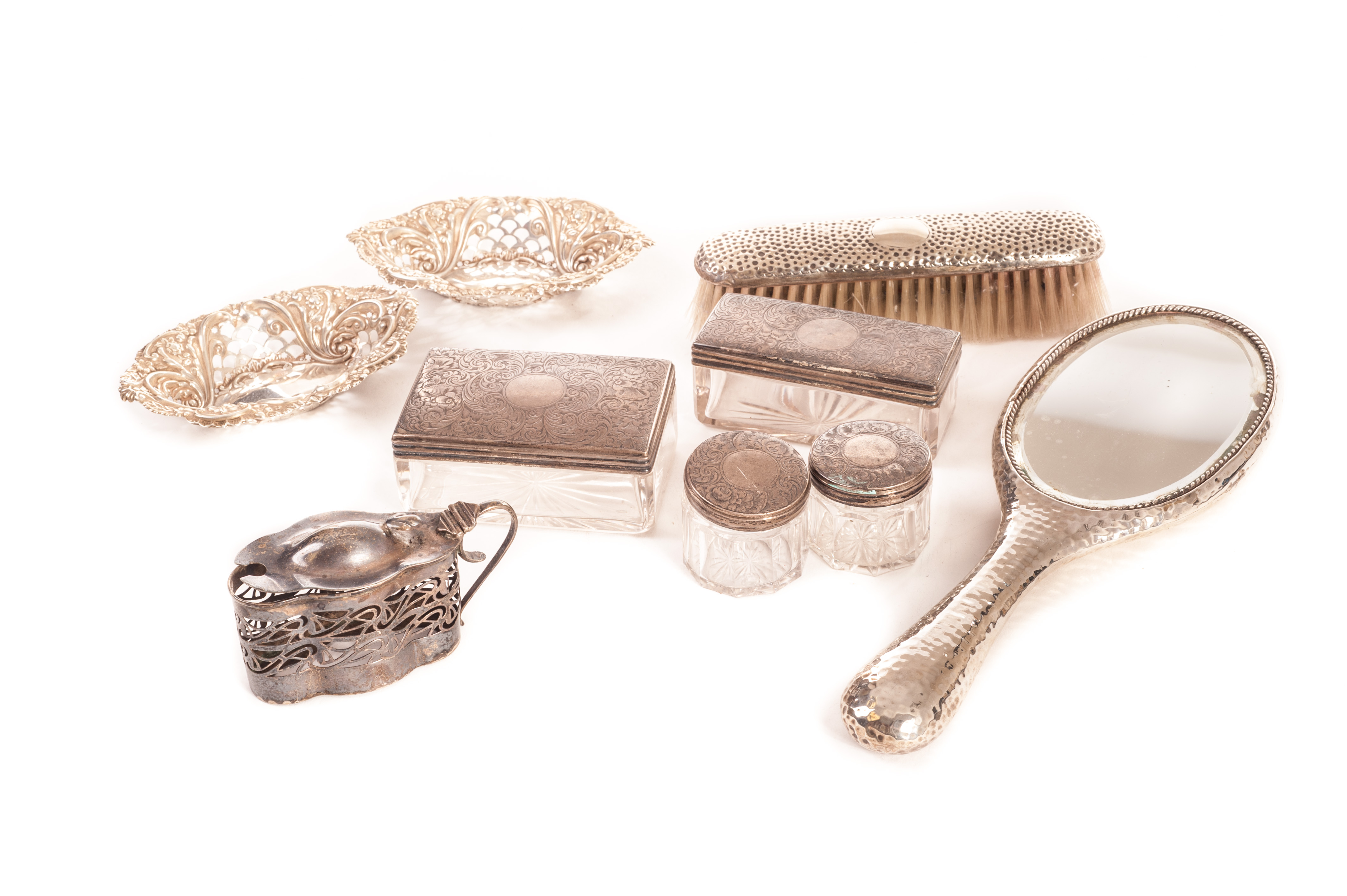 A group of silver items, to include four Victorian silver topped glass dressing table items, an