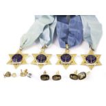 A group of Jewish Masonic items, including four gilt and enamel stars on silk necklaces, two pairs