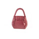 A Must de Cartier style handbag, in maroon leather with hidden press stud clasp 29.5cm W Slight