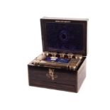 A Victorian Macassar ebony lady’s fitted travel case, complete with silver plated necessaires de
