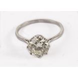 A diamond solitaire engagement ring, the transitional cut stone in eight claw mount, on pierced