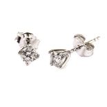 A pair of modern diamond stud earrings, each 18ct gold mount set with an approx 0.3ct brilliant