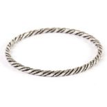 A Danish silver bangle by Georg Jensen, circular with rope twist style design to whole, marked GJ,