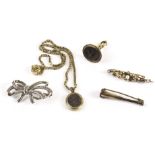 Five items of antique and vintage jewellery, including a fox hunting horn brooch, a seed pearl