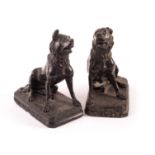 A pair of 20th century black marble renderings of ‘The Dog of Alcibiades’, being marble statues of