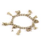 A 9ct gold charm bracelet, the curb link chain united by a heart shaped clasp and supporting