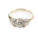 A pretty Edwardian three stone diamond engagement ring, all old cut stones, claw set with small