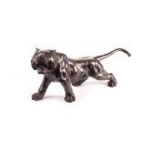 A Japanese late Meiji period bronze figure of a tiger, naturalistically modelled in roaring