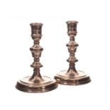 A pair of modern silver filled candlesticks from A.C & Sons, dated London 1968, one AF (2) one