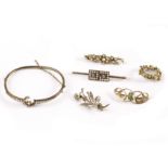 A group of five Victorian and later brooches and a bangle, one bar brooch with two panels of seed